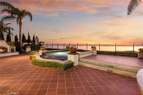 a view of swimming pool with outdoor seating
