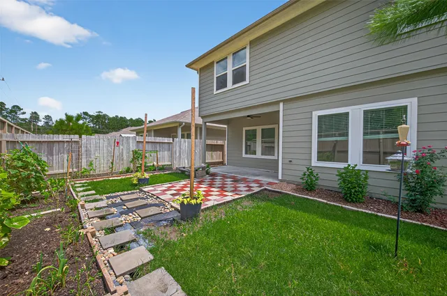 a sign board with flower plants