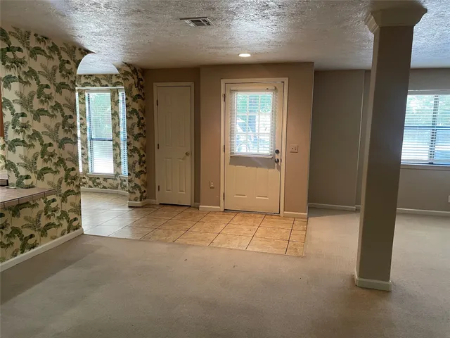 an empty room with windows