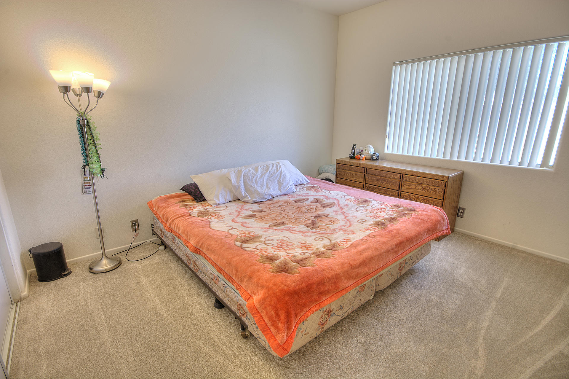 68392 Riviera Road Cathedral City, CA 92234 - Photo 13 of 21 a bedroom with a bed and a lamp