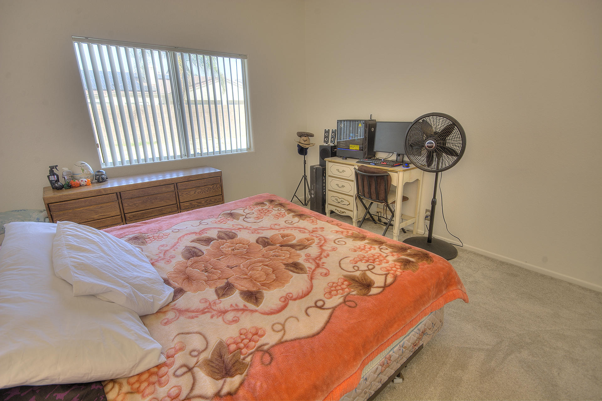 68392 Riviera Road Cathedral City, CA 92234 - Photo 14 of 21 a bedroom with a bed and dresser