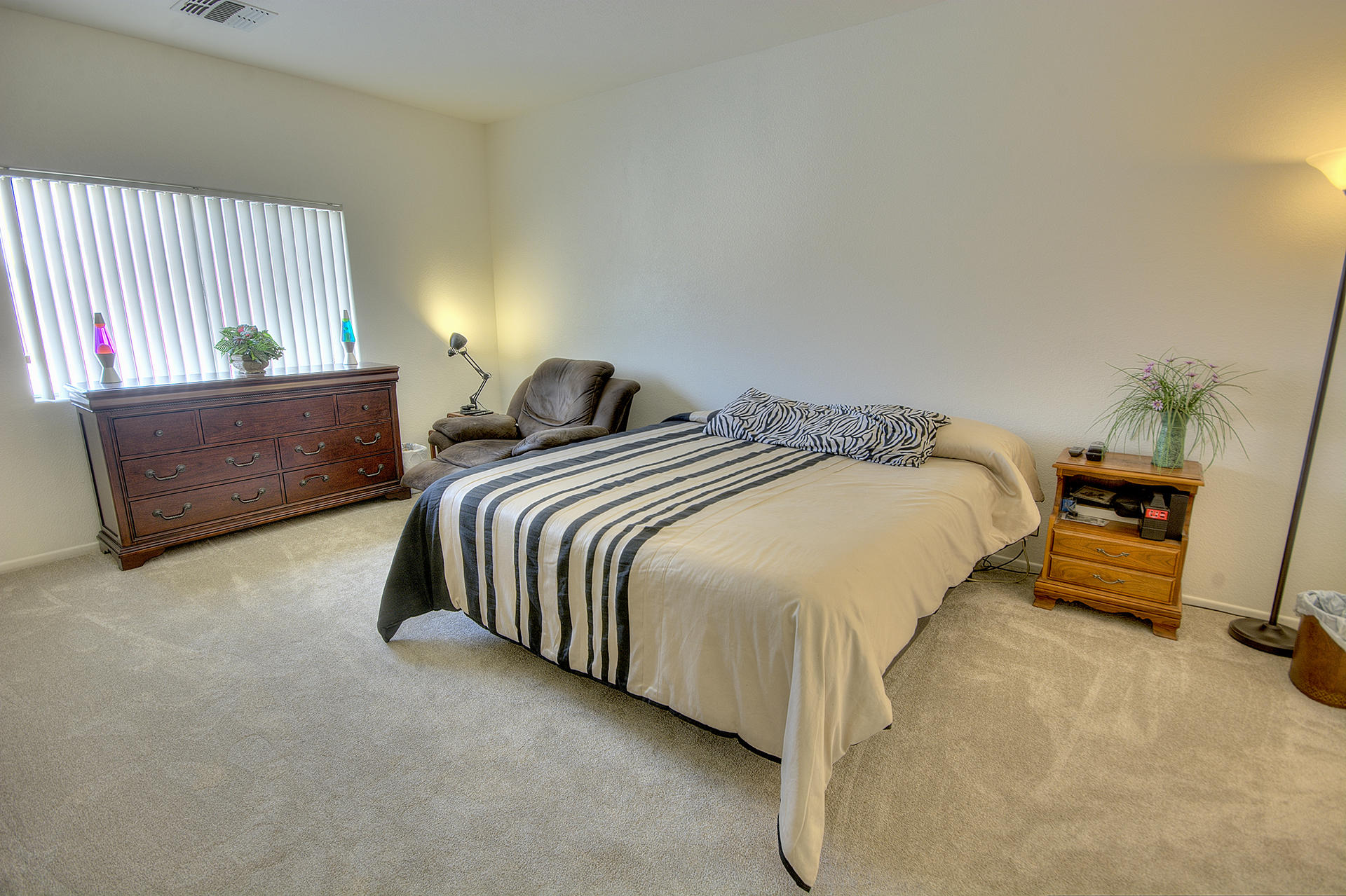68392 Riviera Road Cathedral City, CA 92234 - Photo 15 of 21 a spacious bedroom with two beds and a lamp