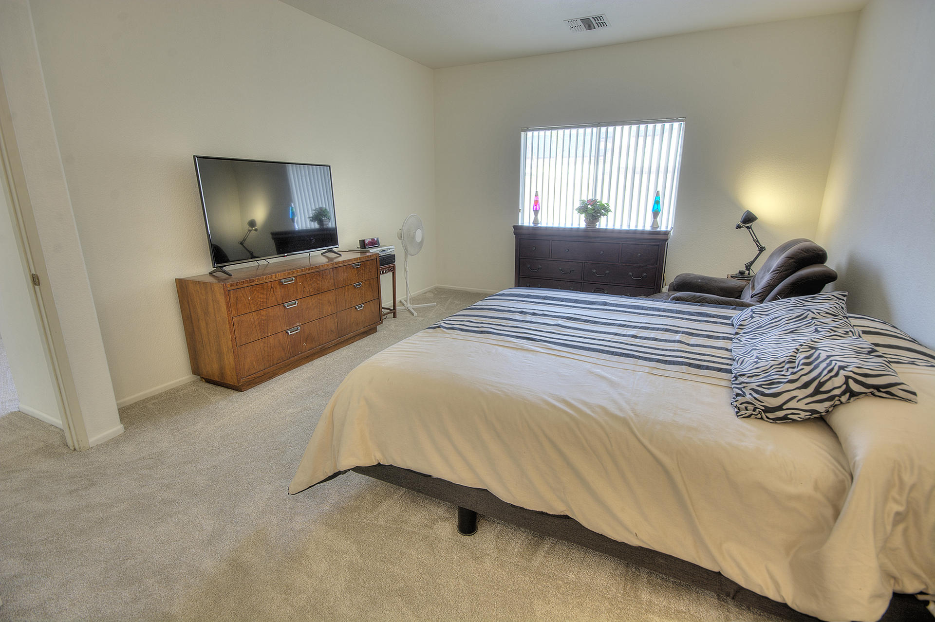 68392 Riviera Road Cathedral City, CA 92234 - Photo 16 of 21 a bedroom with bed and window