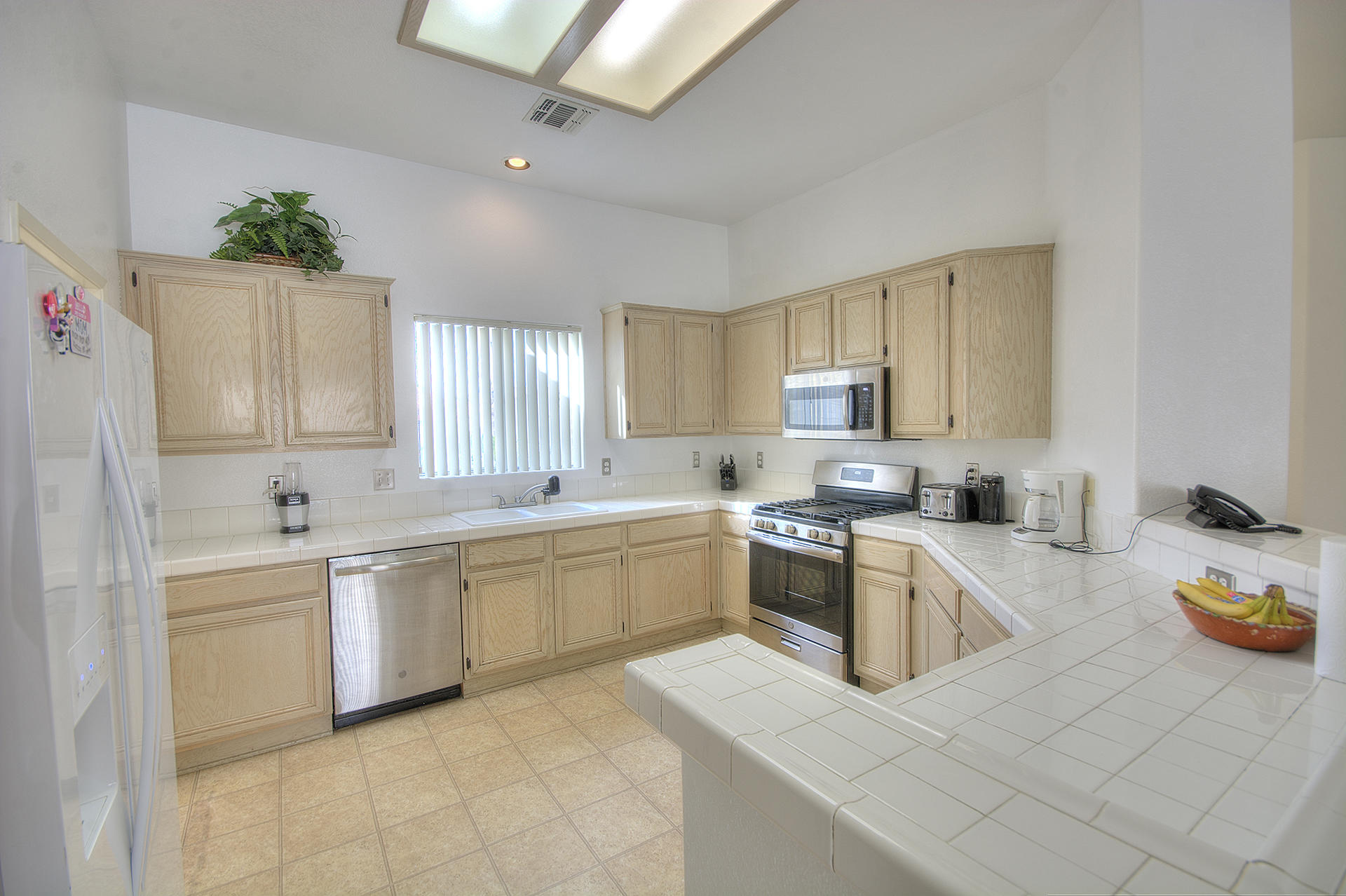 68392 Riviera Road Cathedral City, CA 92234 - Photo 2 of 21 a kitchen with sink and cabinets