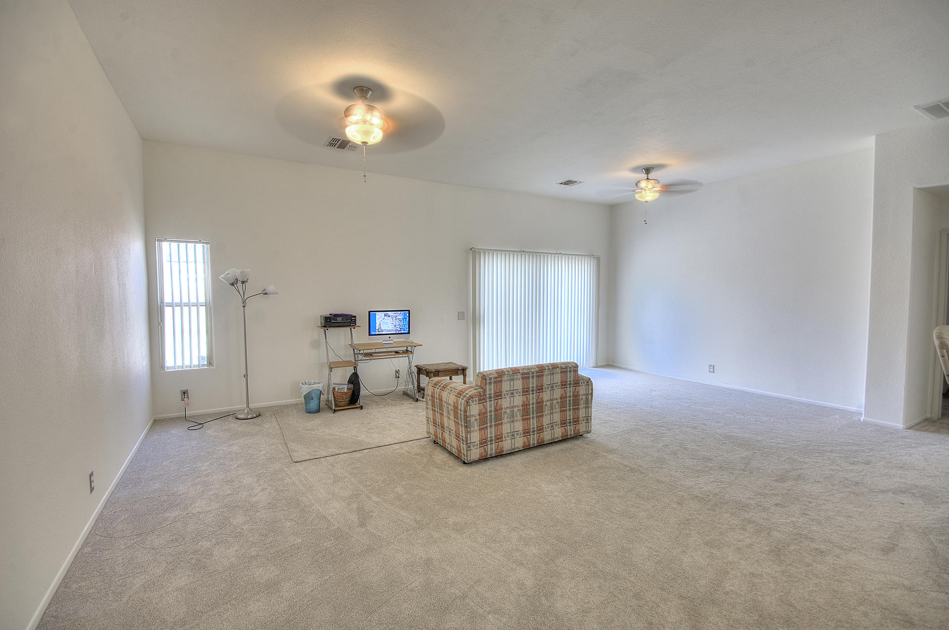 68392 Riviera Road Cathedral City, CA 92234 - Photo 4 of 21 a living room with furniture and a chandelier