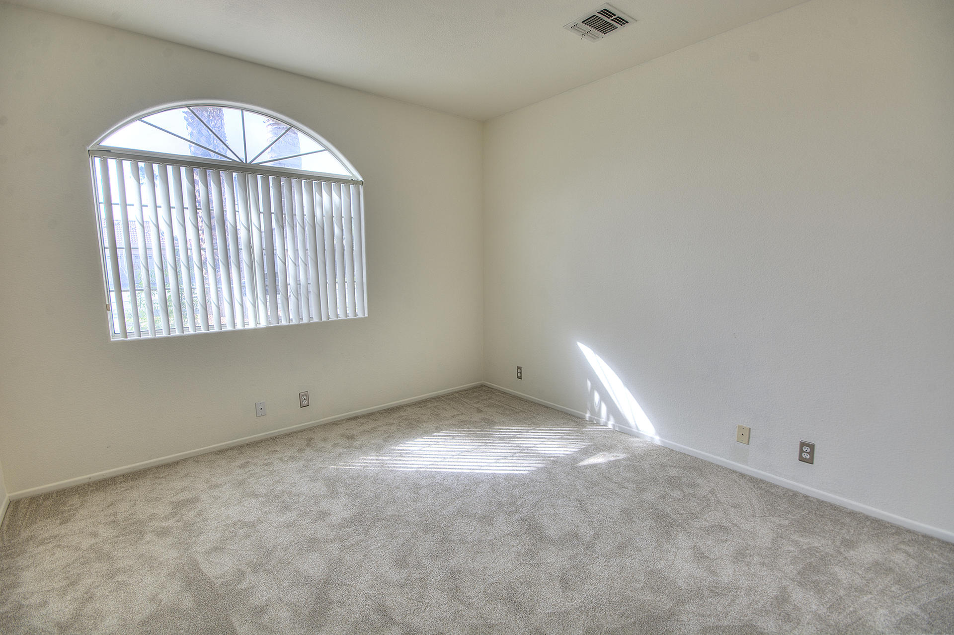 68392 Riviera Road Cathedral City, CA 92234 - Photo 10 of 21 an empty room with a empty space and windows