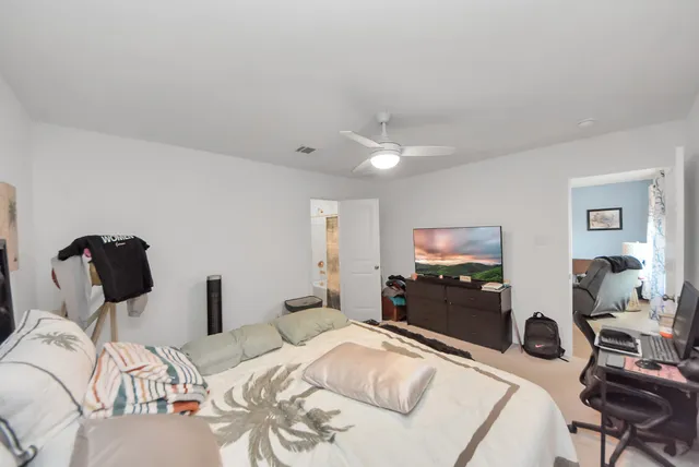 a bedroom with a bed and furniture