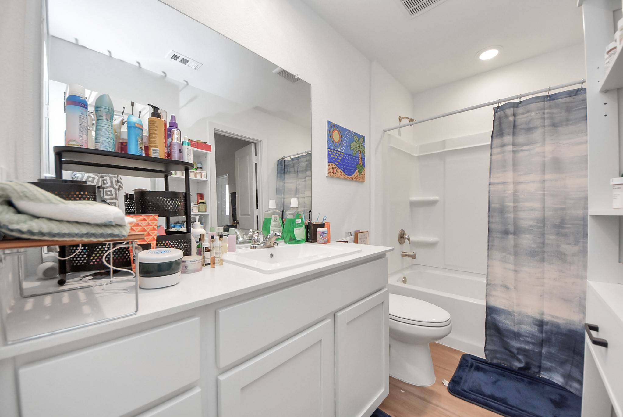 1719 Windrose Bend Angleton, TX 77515 - Photo 23 of 31 a bathroom with a sink a toilet and shower