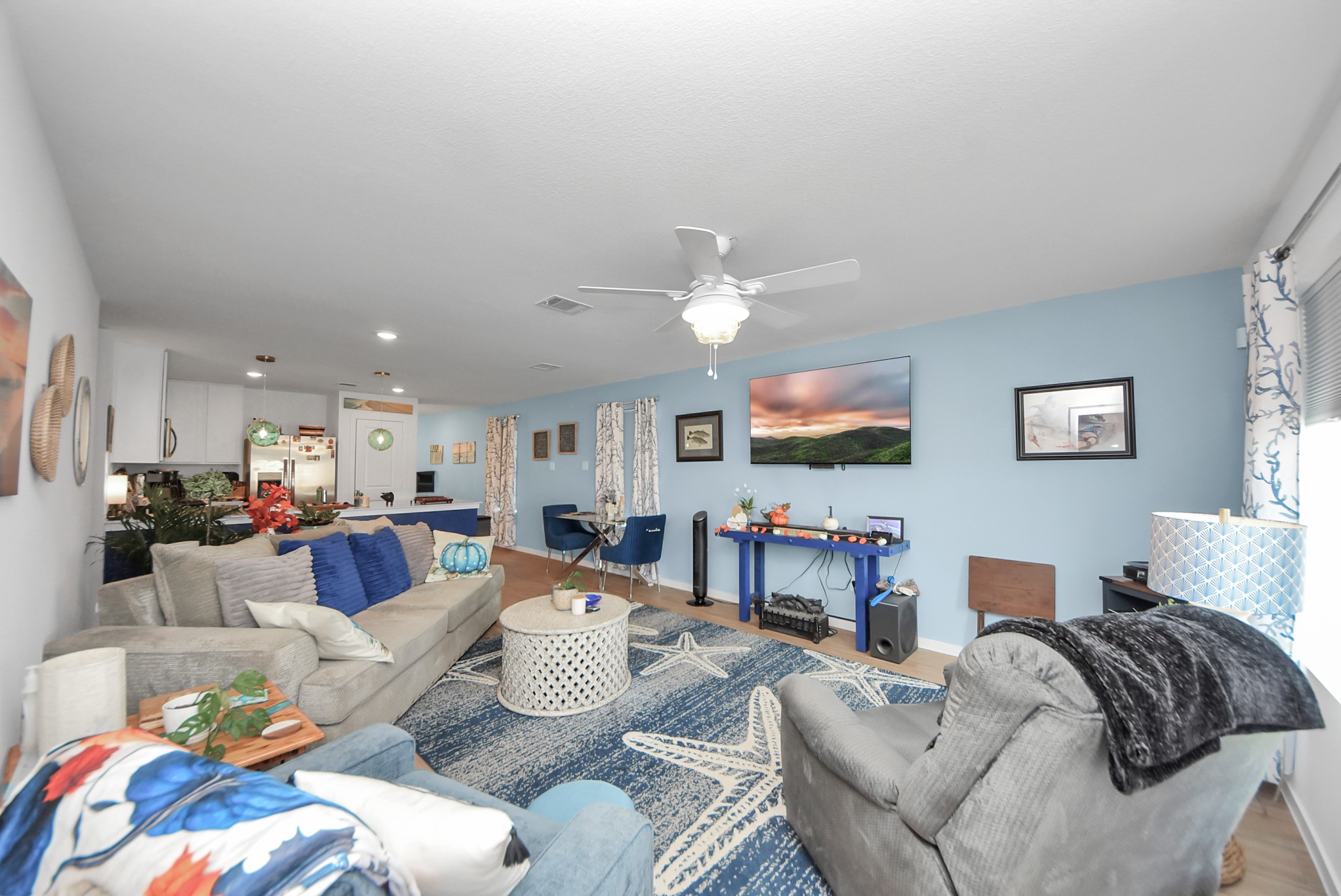 1719 Windrose Bend Angleton, TX 77515 - Photo 8 of 31 a living room with furniture and a flat screen tv