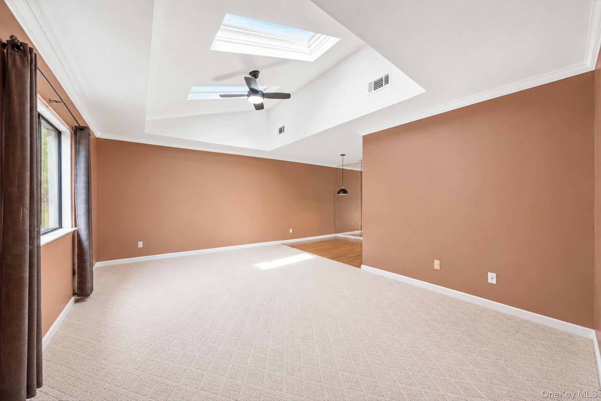 94 Birchwood Road Coram, NY 11727 - Photo 23 of 34 Living room featuring double functioning skylights.
