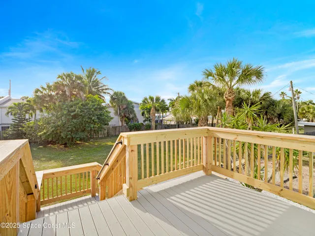 a view of deck with a large trees