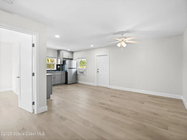 a view of a kitchen with a sink and a stove top oven