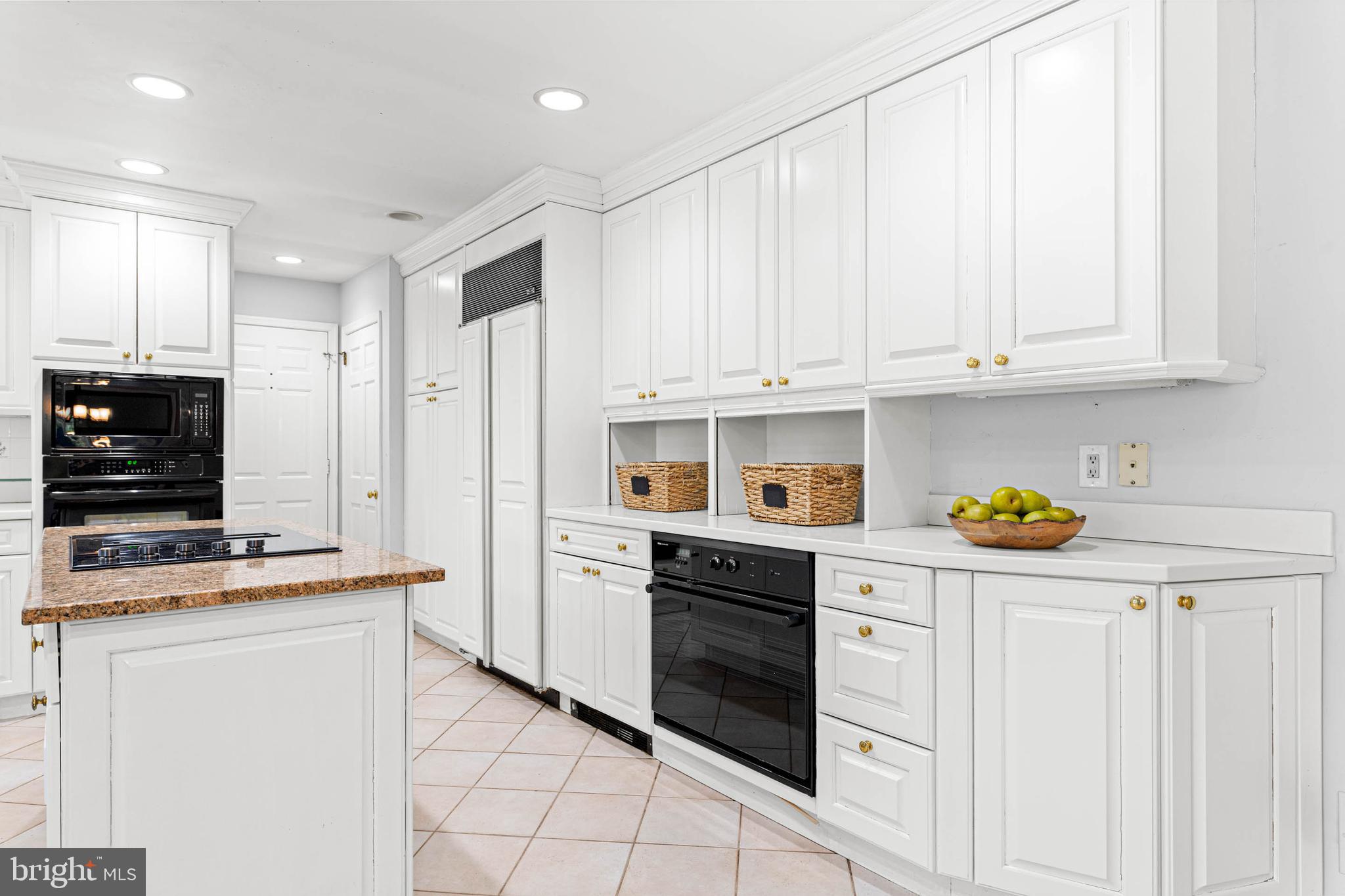 533 Gulph Road Wayne, PA 19087 - Photo 8 of 43 a kitchen with stainless steel appliances granite countertop a refrigerator and a stove top oven