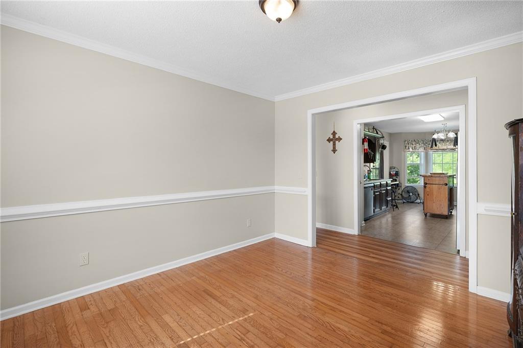 240 Orchard Way Southeast Calhoun, GA 30701 - Photo 13 of 38 a view of a livingroom with wooden floor