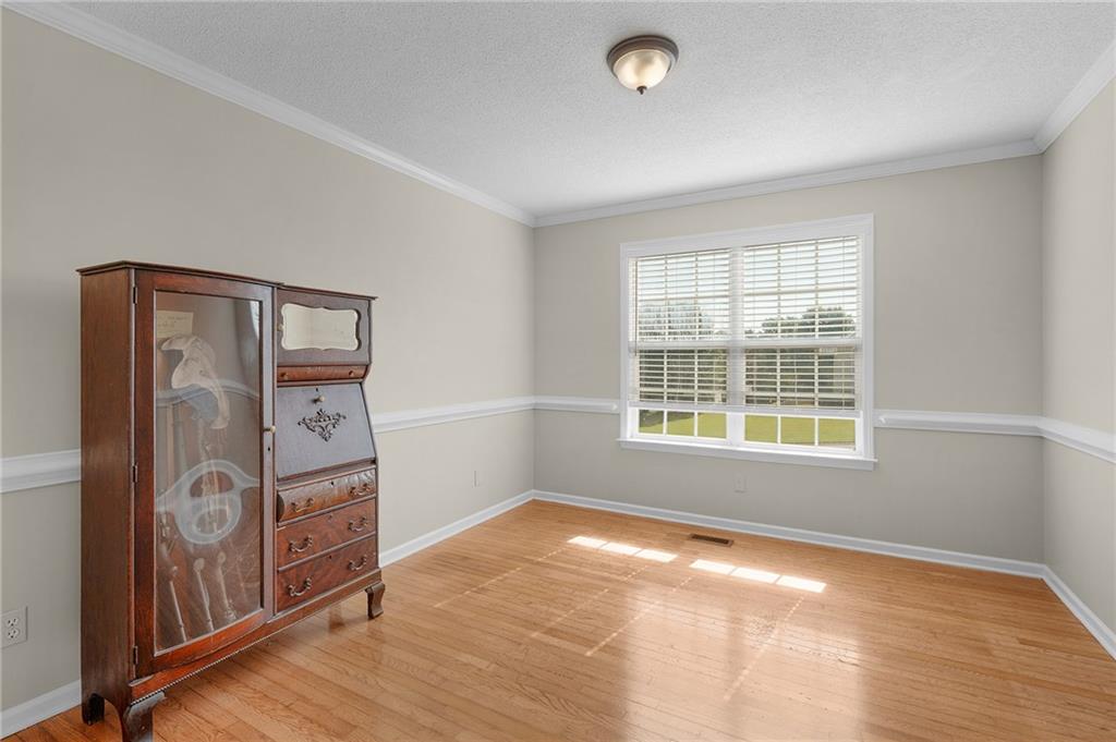240 Orchard Way Southeast Calhoun, GA 30701 - Photo 14 of 38 an empty room with windows and closet