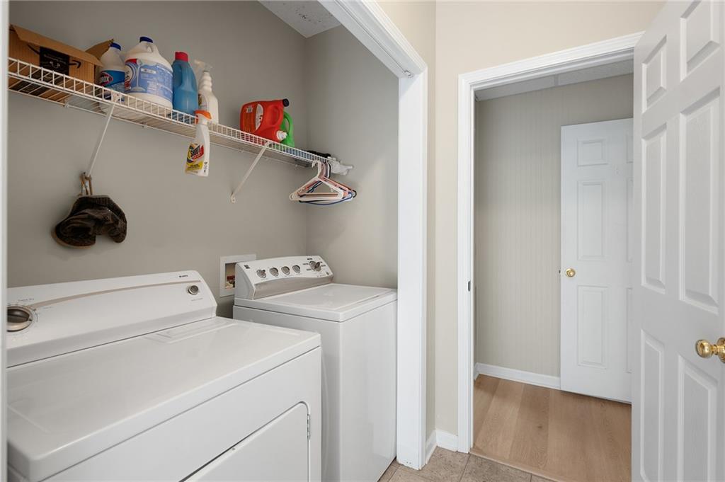 240 Orchard Way Southeast Calhoun, GA 30701 - Photo 28 of 38 a view of storage and utility room with washer and dryer