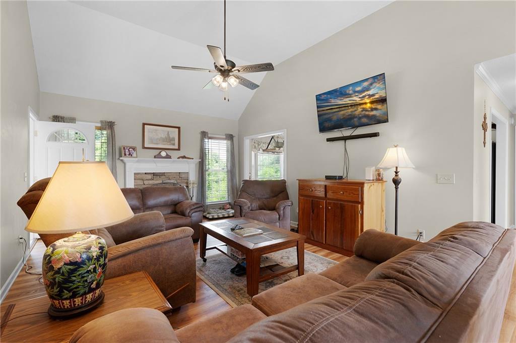 240 Orchard Way Southeast Calhoun, GA 30701 - Photo 6 of 38 a living room with furniture and a flat screen tv