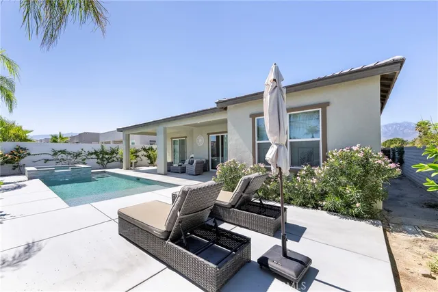 a large kitchen with lots of counter top space and stainless steel appliances