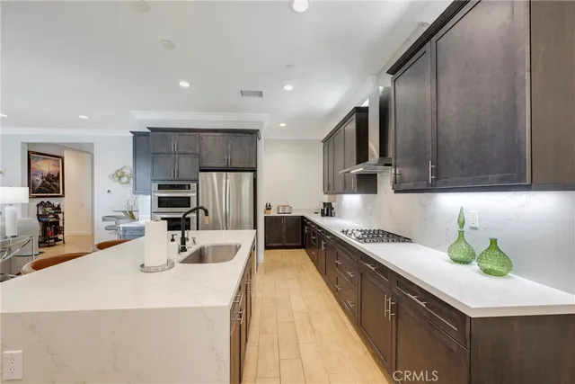 a bathroom with a sink shower and a mirror