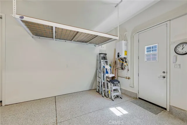a living room with furniture and a book shelf