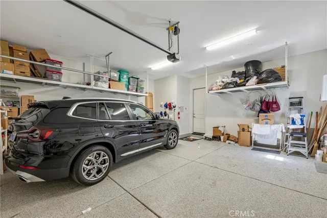 a living room with furniture and a book shelf