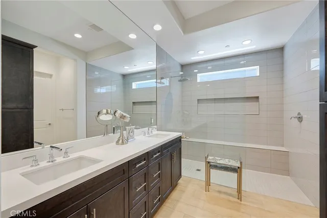 a living room with furniture and a book shelf