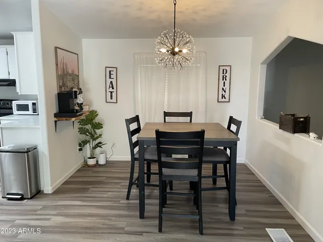a kitchen with cabinets appliances and a sink