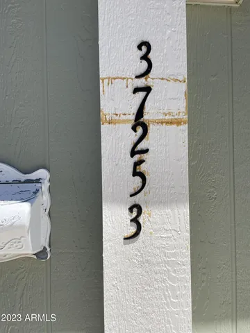 a front view of a house with trees