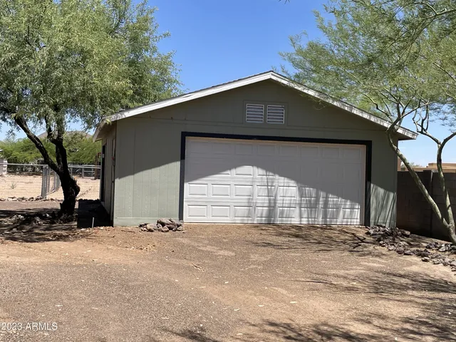 a view of a house with a snow in the yard