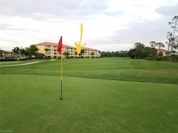 a view of a golf course with a lake