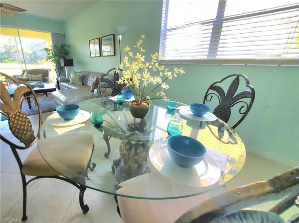 a view of a dining room with furniture window and outside view