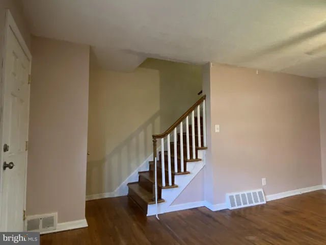 a view of entryway with wooden floor