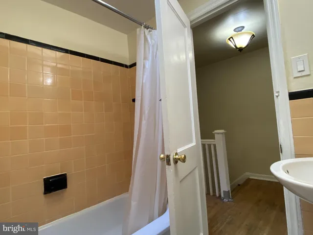 a bathroom with a shower and a toilet