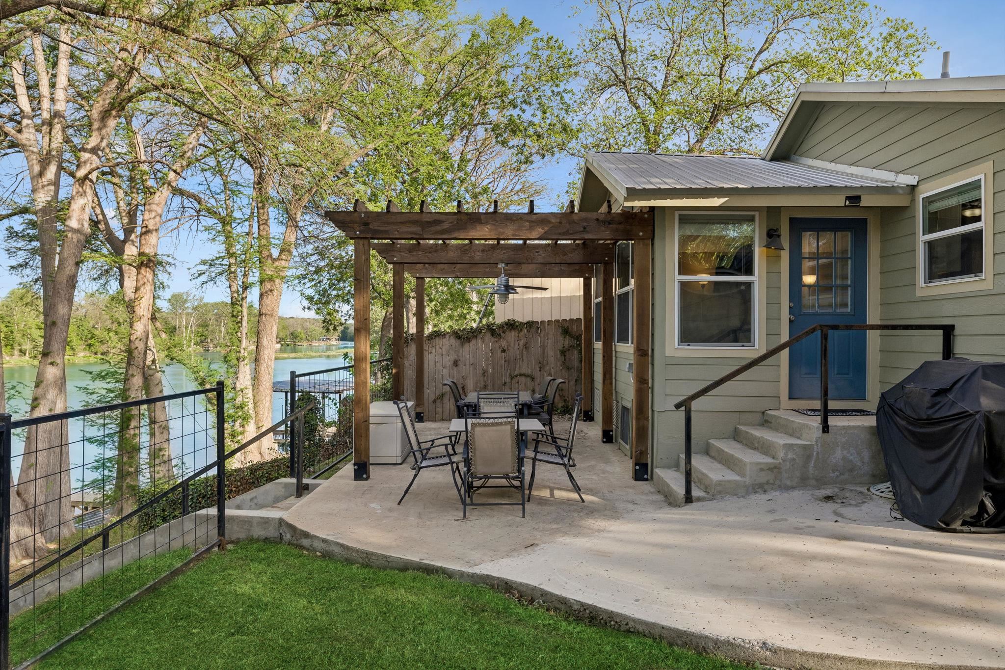 230 Lee Street Seguin, TX 78155 - Photo 11 of 40 a patio with yard table and chairs