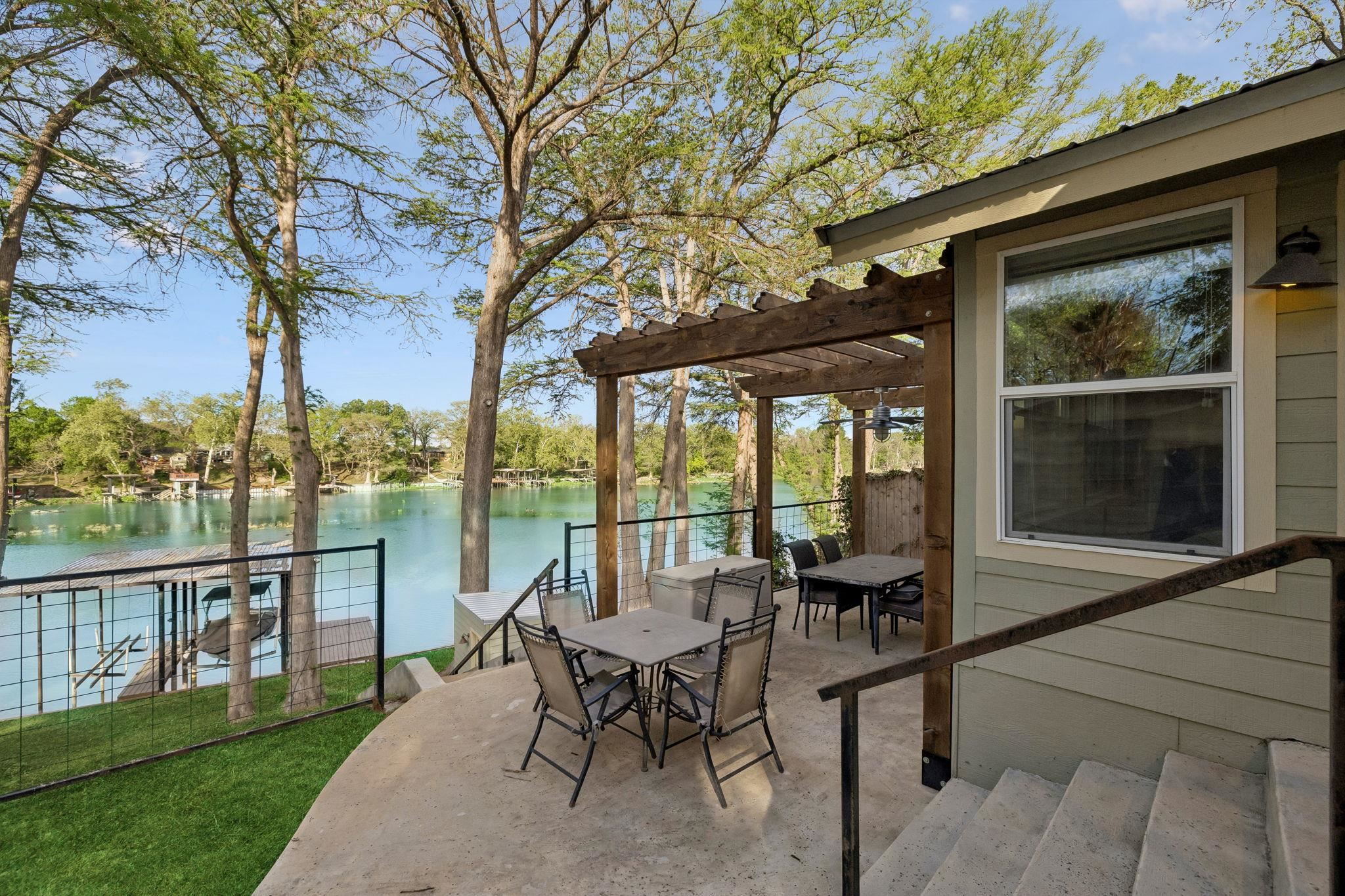 230 Lee Street Seguin, TX 78155 - Photo 12 of 40 a view of a patio with chairs next to a yard