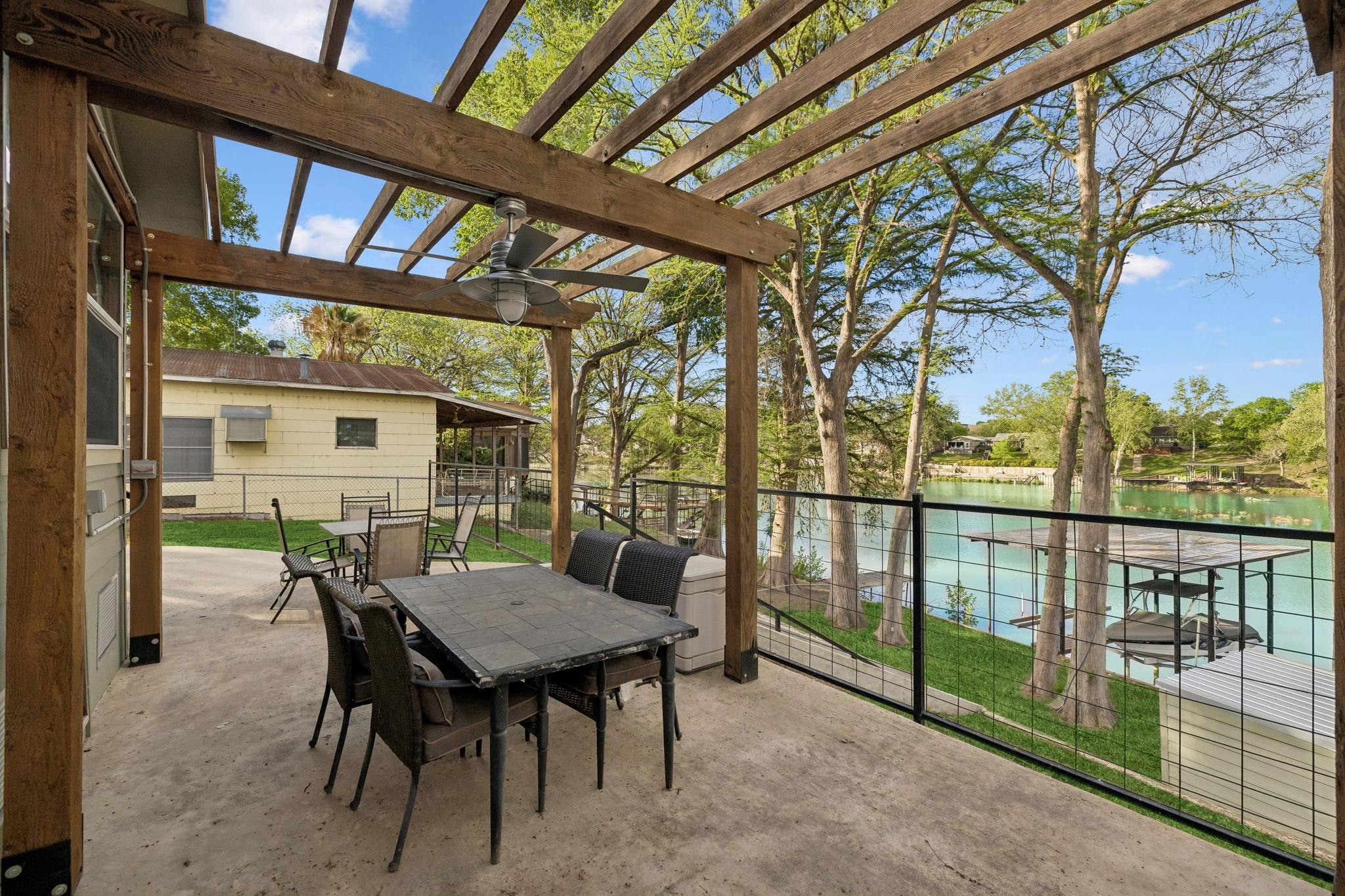 230 Lee Street Seguin, TX 78155 - Photo 13 of 40 a view of a patio with a table chairs and a backyard