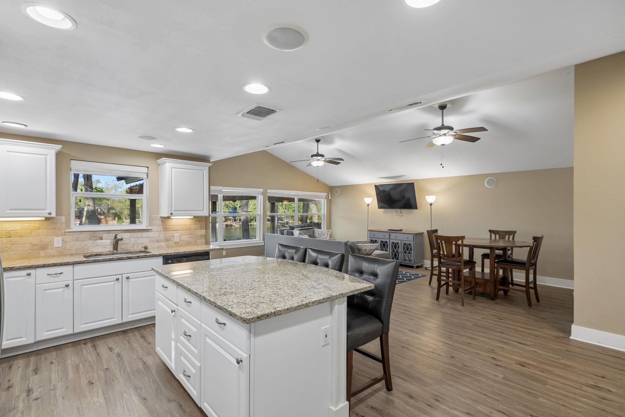 230 Lee Street Seguin, TX 78155 - Photo 16 of 40 a open kitchen with stainless steel appliances granite countertop a sink and stove