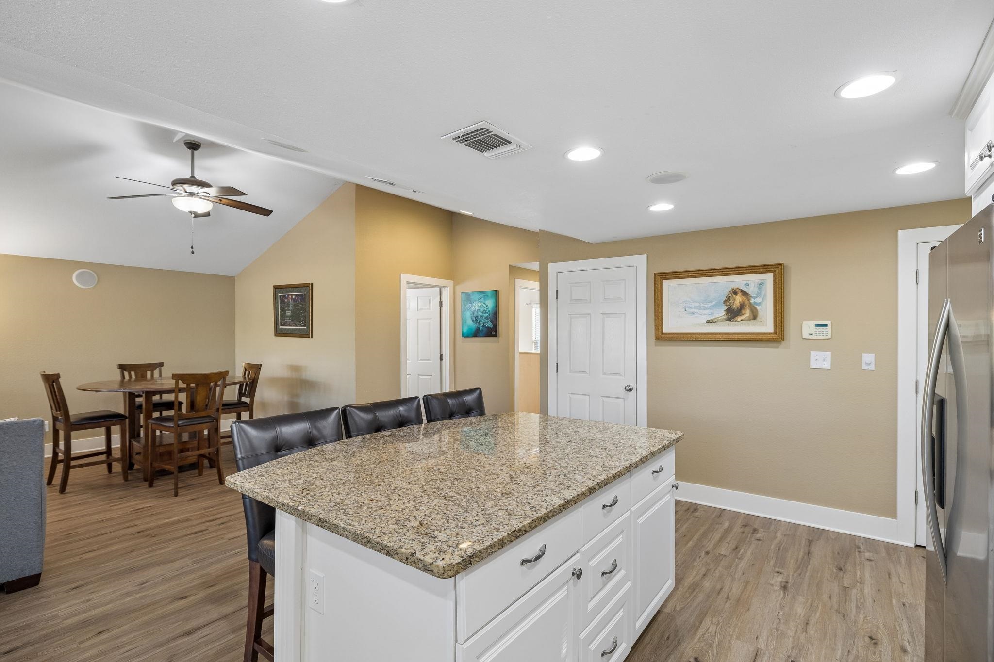 230 Lee Street Seguin, TX 78155 - Photo 17 of 40 a kitchen with stainless steel appliances granite countertop a sink and a refrigerator