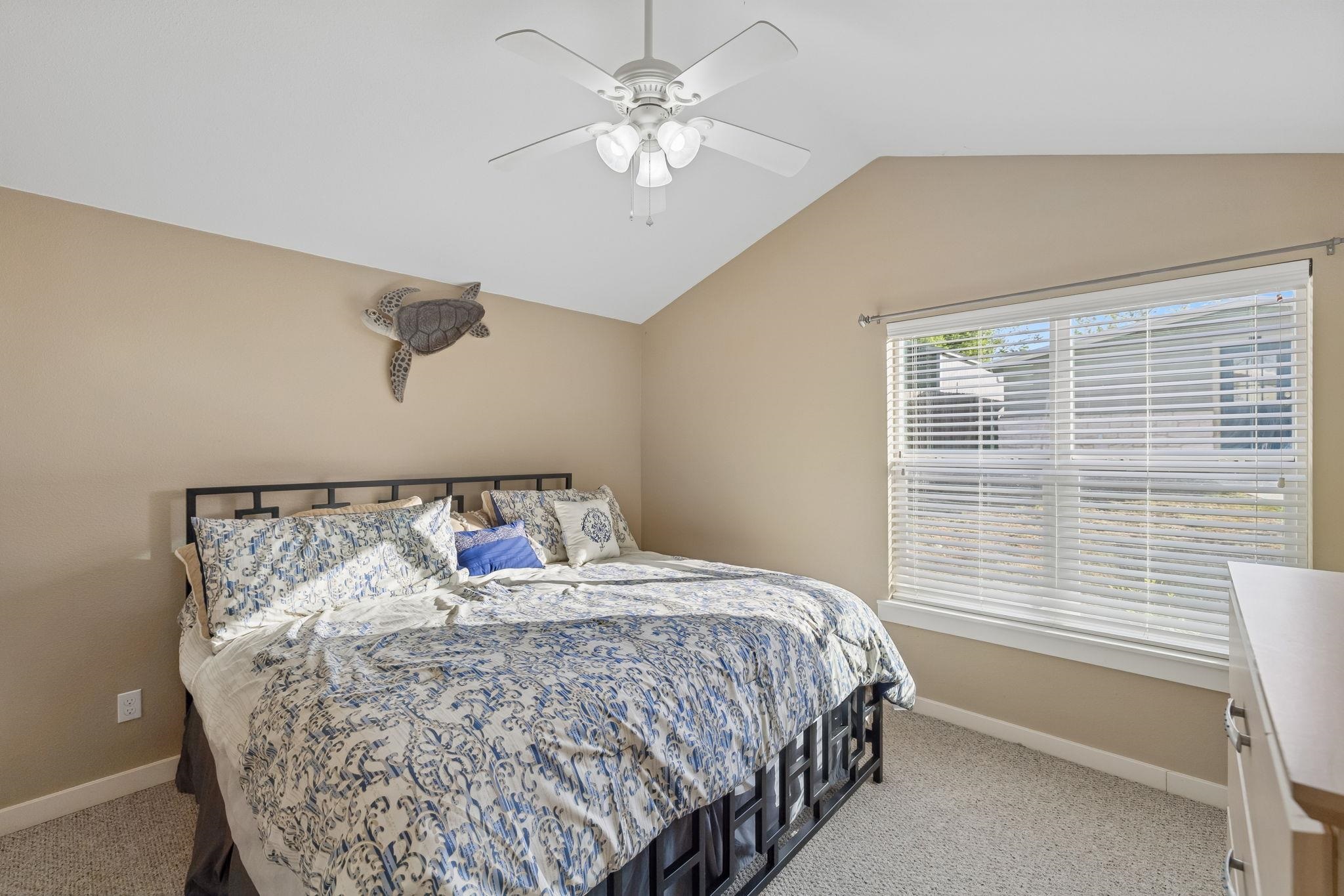 230 Lee Street Seguin, TX 78155 - Photo 25 of 40 a bed sitting in a bedroom next to a window