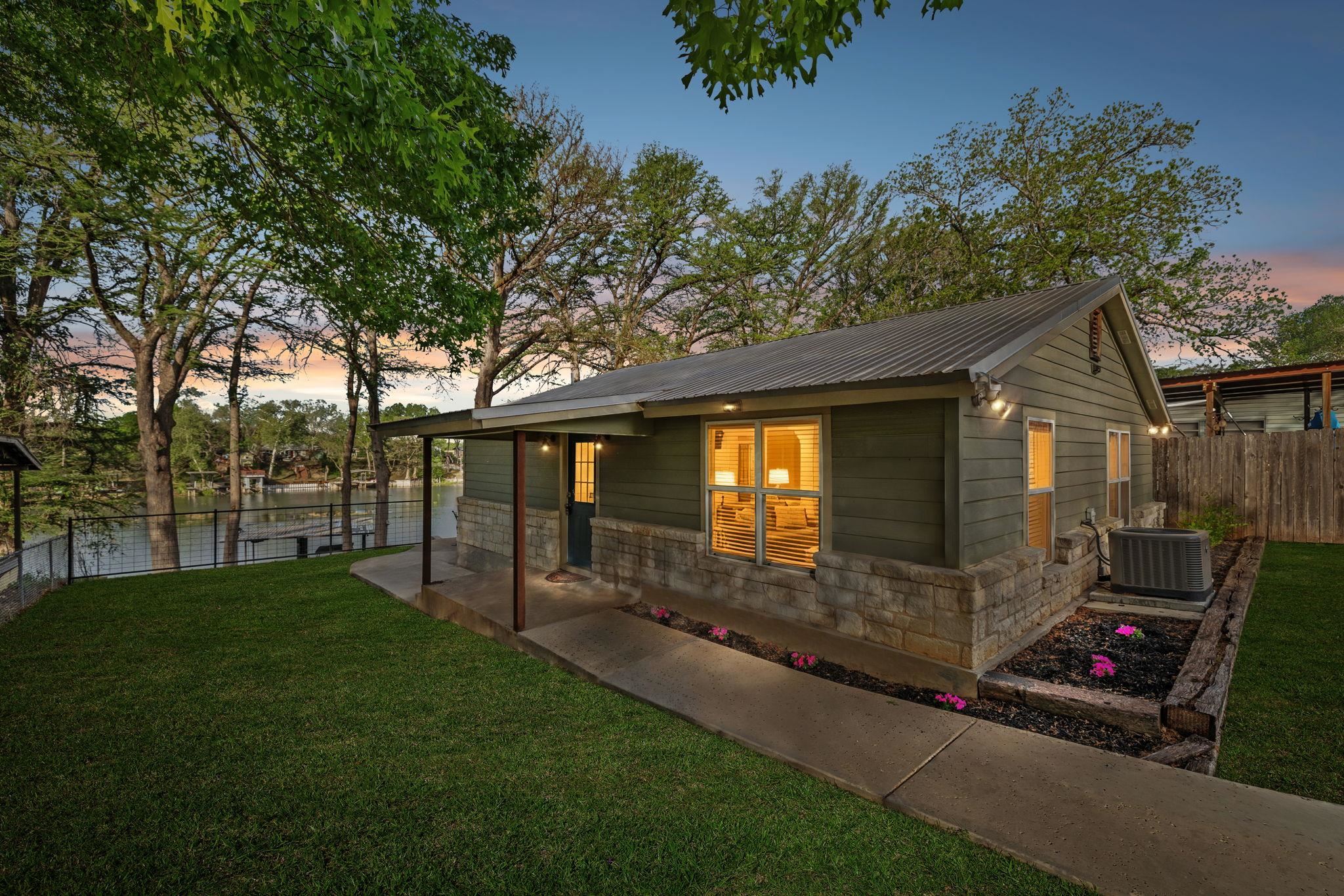 230 Lee Street Seguin, TX 78155 - Photo 40 of 40 a view of a backyard with couches plants and large trees