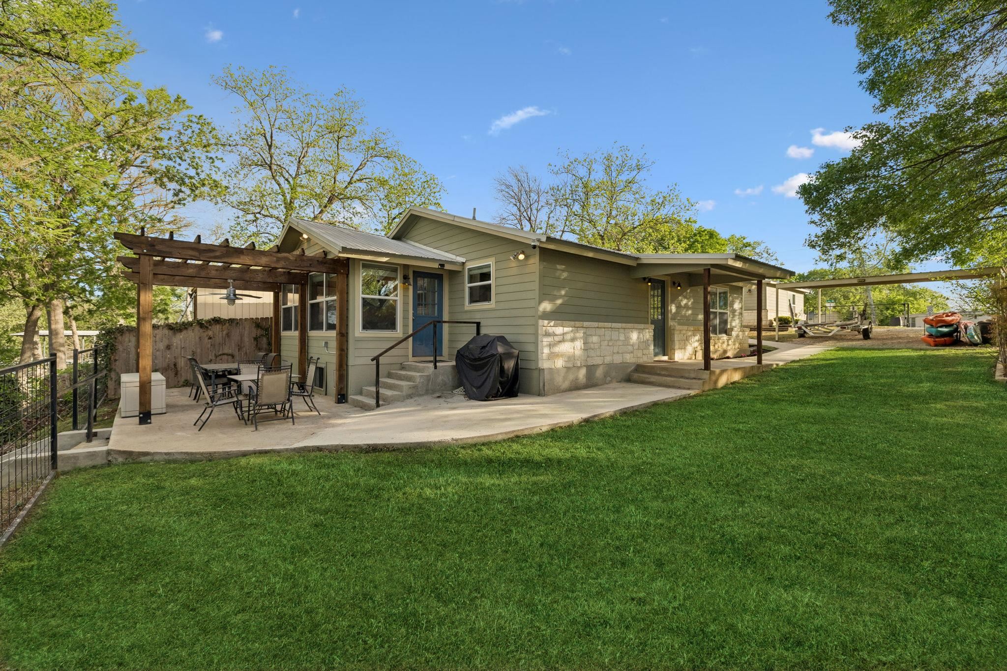230 Lee Street Seguin, TX 78155 - Photo 10 of 40 a front view of a house with a yard porch and sitting area