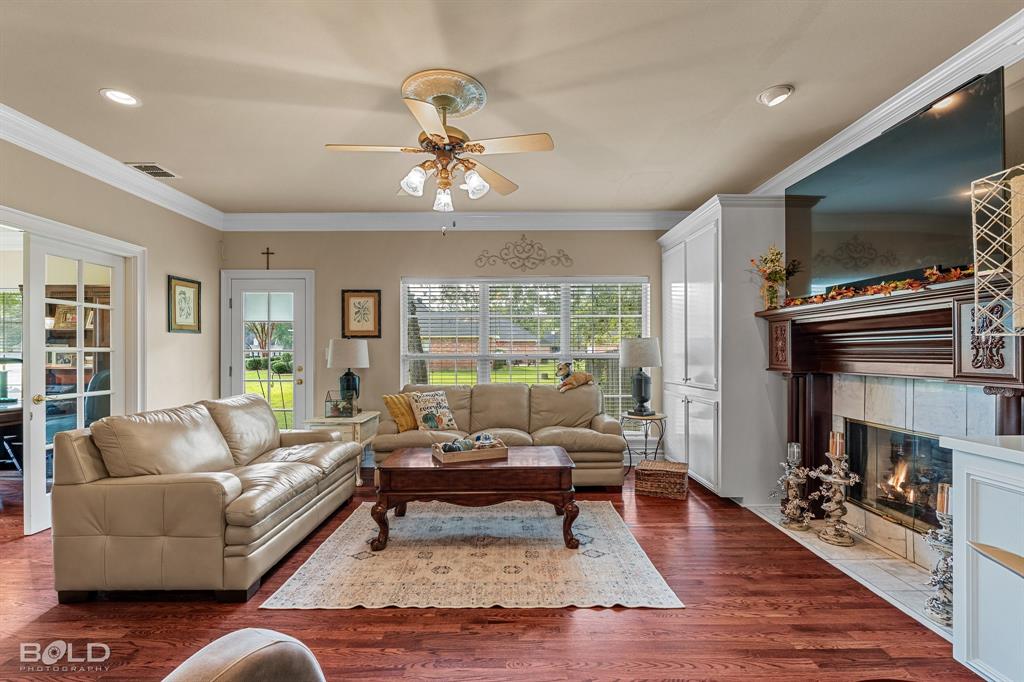 10722 Provence Place Keithville, LA 71047 - Photo 11 of 23 A wall of windows across the living room allow wonderful natural light