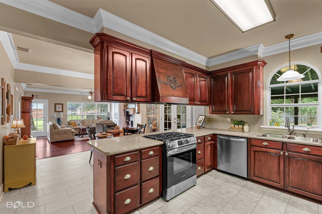 10722 Provence Place Keithville, LA 71047 - Photo 15 of 23 Luxury Vinyl flooring in the kitchen, utility room and half bath