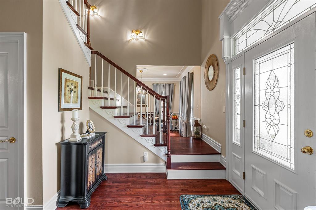 10722 Provence Place Keithville, LA 71047 - Photo 8 of 23 2 story entryway has an open stairway leading to the bedrooms