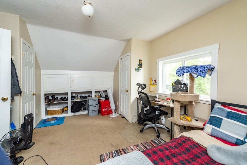 28 Walnut Street Natick, MA 01760 - Photo 17 of 24 a view of a workspace with furniture and toys