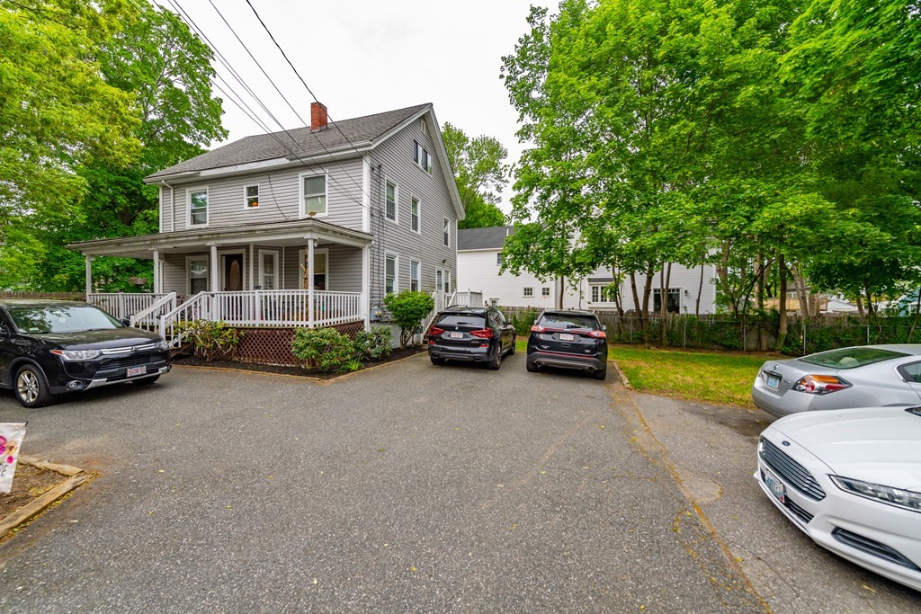 28 Walnut Street Natick, MA 01760 - Photo 2 of 24 a house view with a garden space