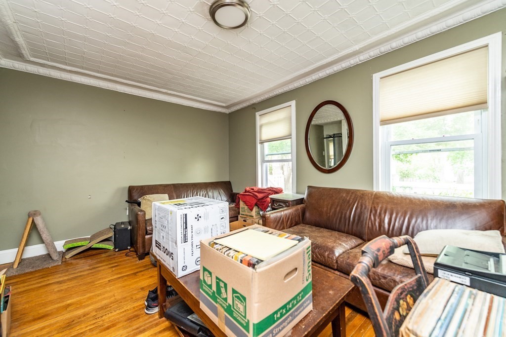 28 Walnut Street Natick, MA 01760 - Photo 21 of 24 a living room with furniture and a window