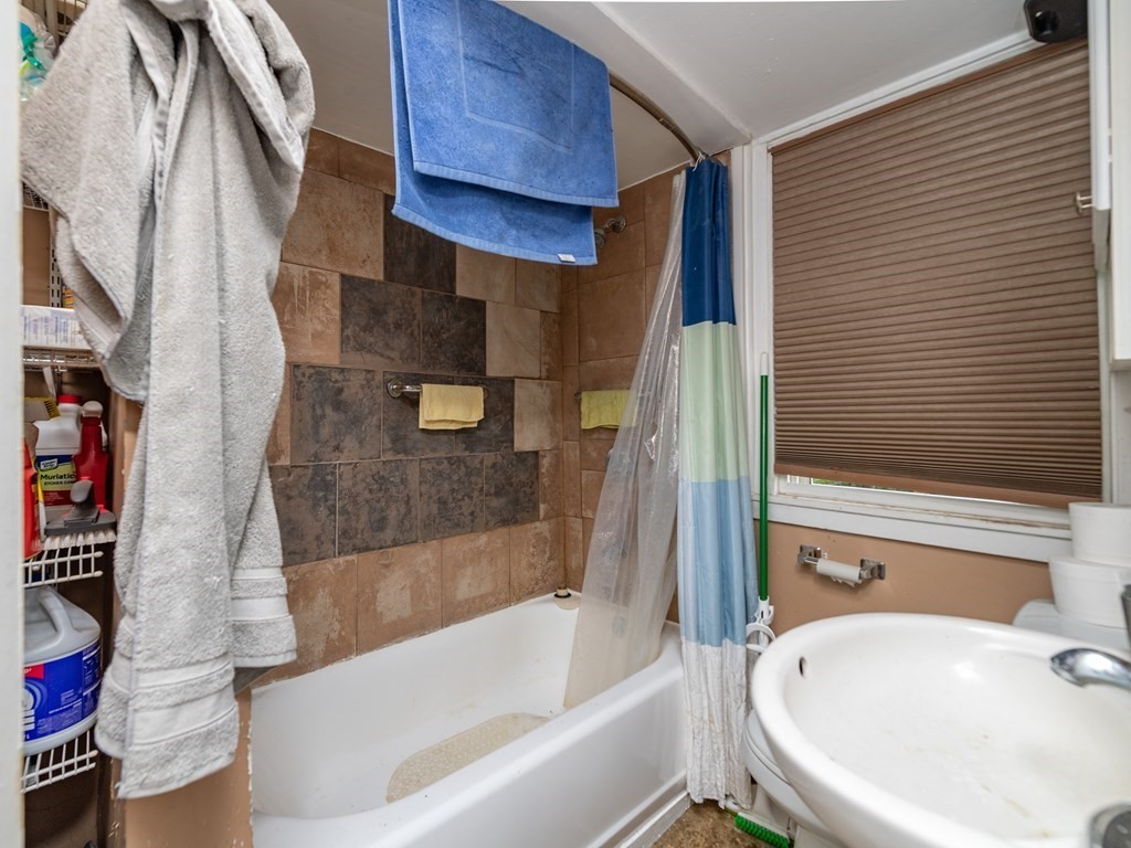 28 Walnut Street Natick, MA 01760 - Photo 24 of 24 a bathroom with a bathtub and a sink