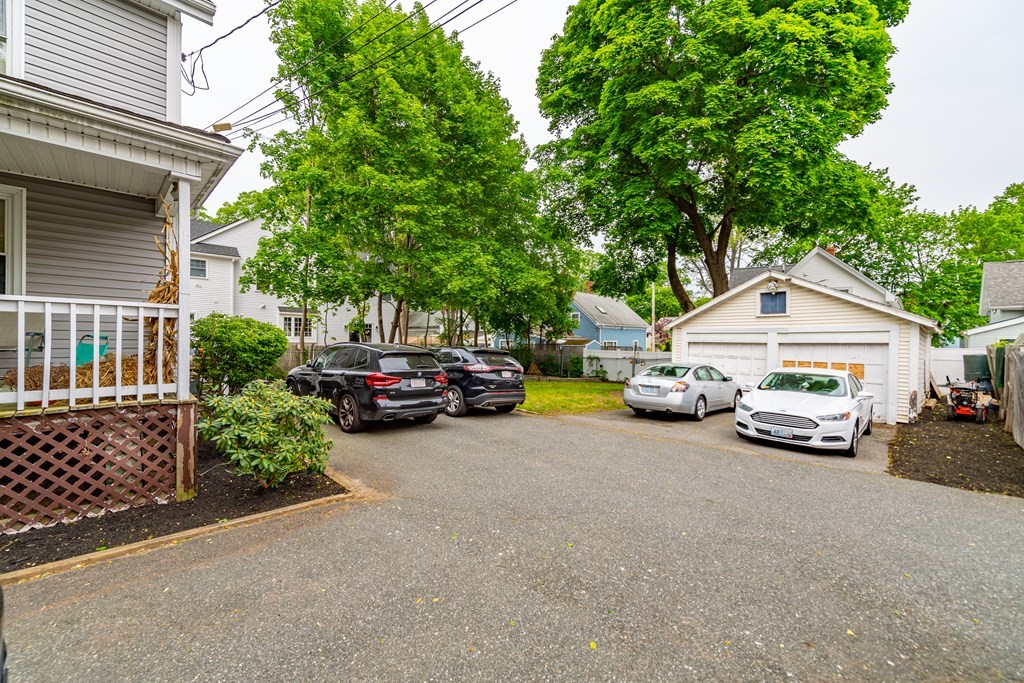 28 Walnut Street Natick, MA 01760 - Photo 3 of 24 a view of a car in front of a house