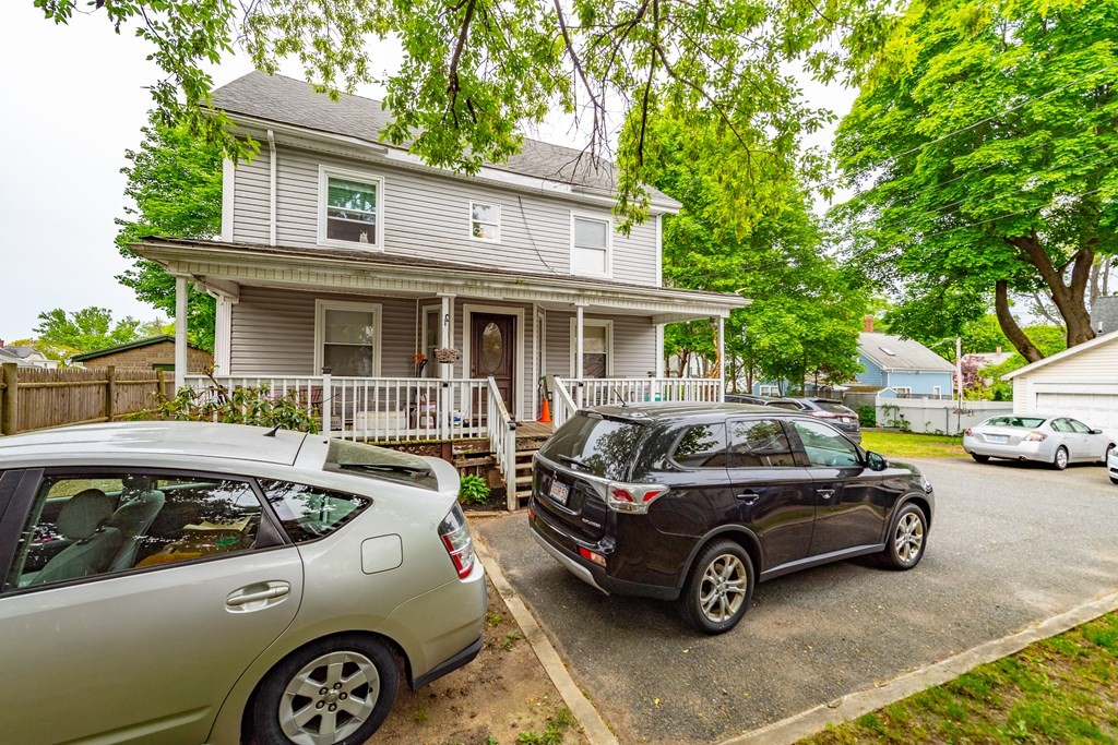 28 Walnut Street Natick, MA 01760 - Photo 4 of 24 a view of a car parked in front of a house